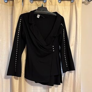Black off the shoulder top with pearl detail with zipper on side.